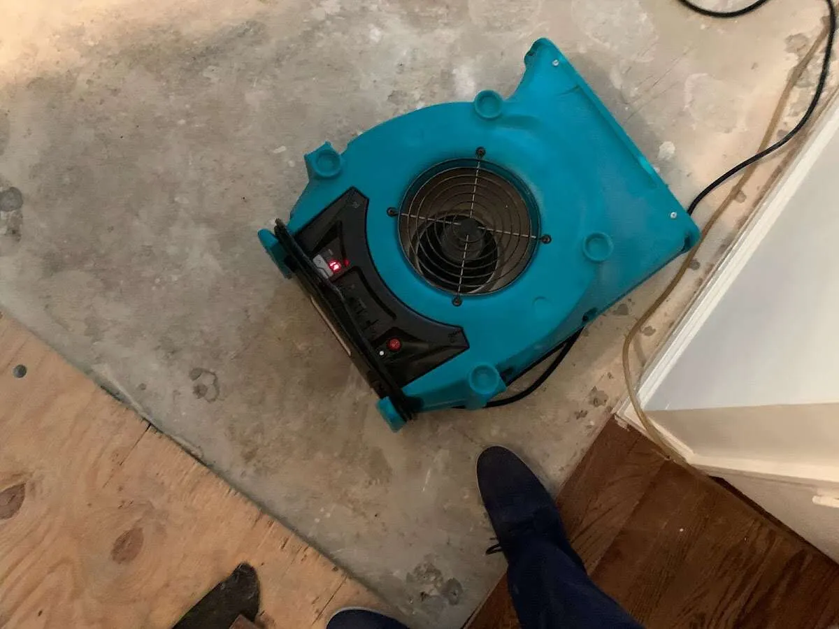 Air mover drying subfloor during Leak Detection & Repair in West Rockhill